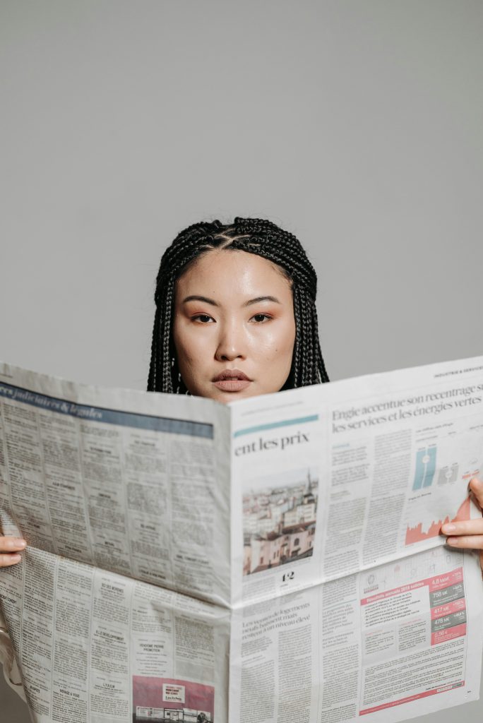 Woman reading a newspaper
